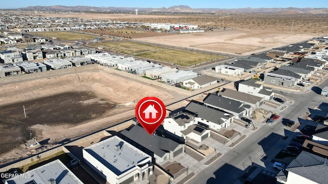 birds eye view of property featuring a mountain view