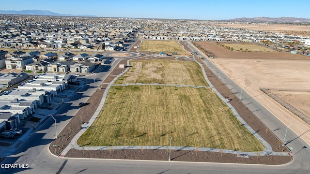 birds eye view of property featuring a mountain view