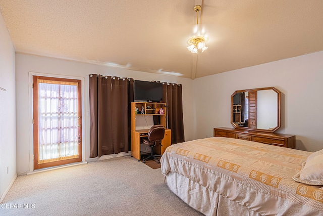 carpeted bedroom with a textured ceiling