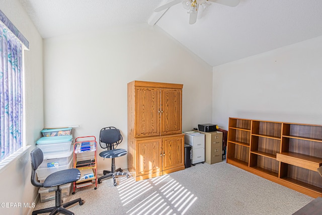 office area with carpet flooring, lofted ceiling with beams, and ceiling fan