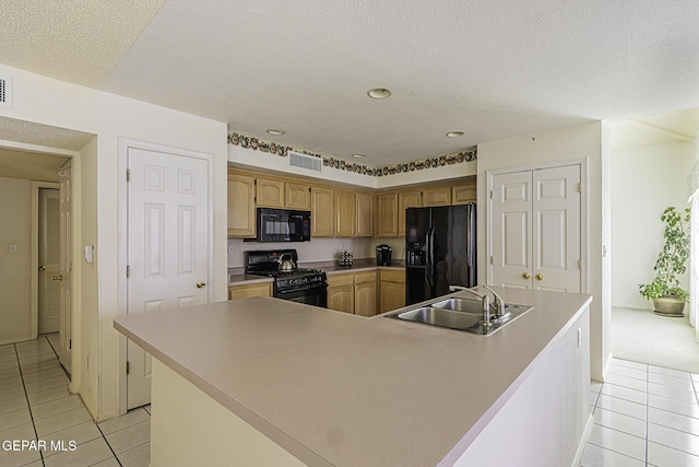 4228 Marcus Uribe Dr, El Paso, TX 79934 - kitchen with black appliances, a sink, light tile patterned floors, a large island, and a textured ceiling
