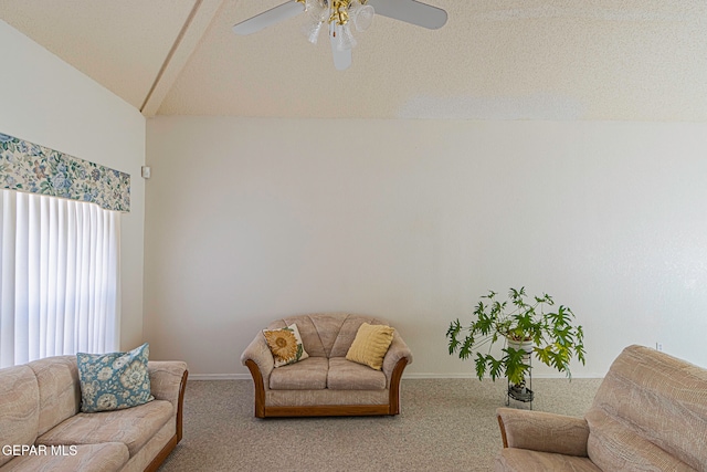 carpeted living room featuring a textured ceiling, ceiling fan, and vaulted ceiling