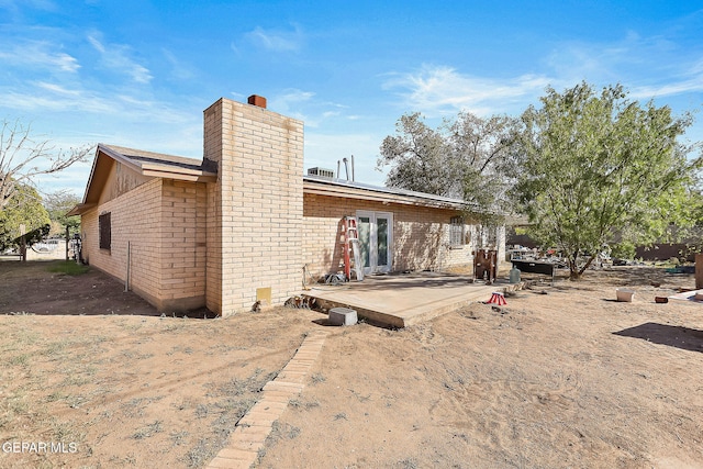 back of house with a patio area