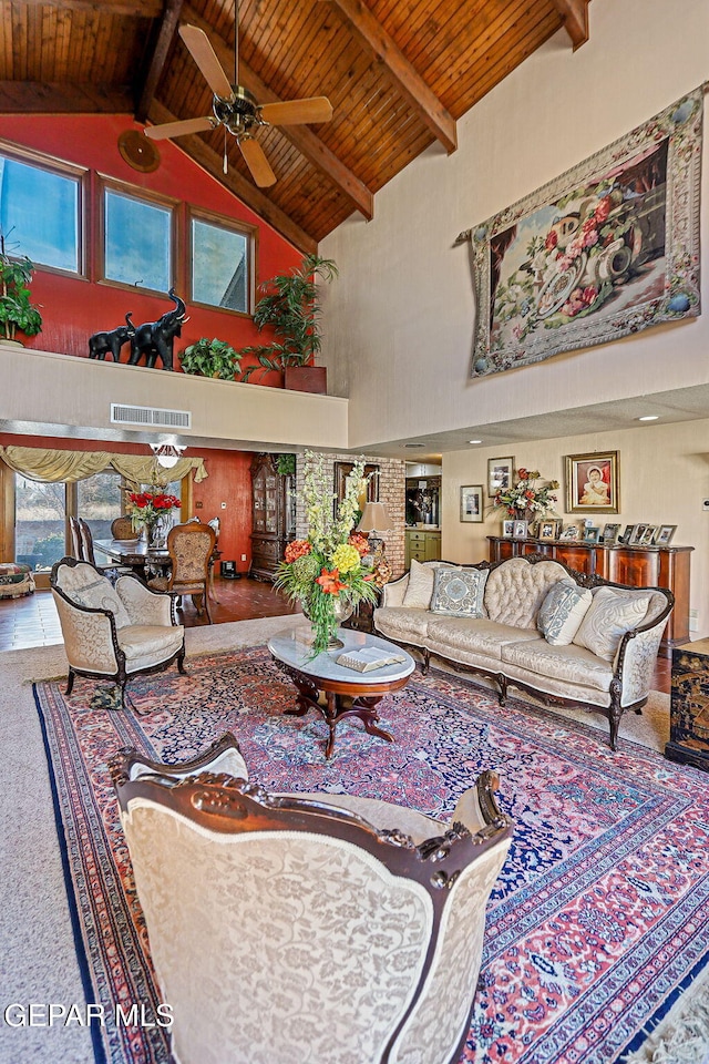 living room with ceiling fan, beam ceiling, wood ceiling, and high vaulted ceiling