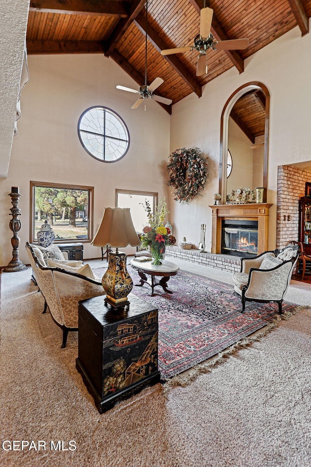 living room with carpet, beam ceiling, wooden ceiling, and high vaulted ceiling