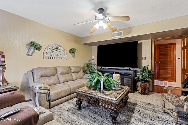 living room with carpet flooring and ceiling fan