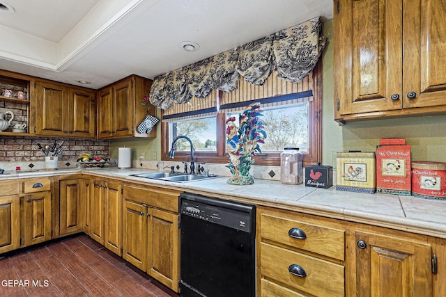 kitchen featuring sink, decorative backsplash, black dishwasher, tile counters, and dark hardwood / wood-style flooring