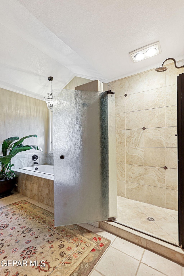 bathroom with plus walk in shower, a textured ceiling, tile patterned floors, and lofted ceiling