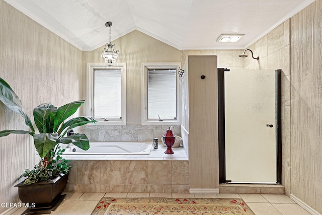 bathroom with tile patterned floors, vaulted ceiling, ornamental molding, and independent shower and bath