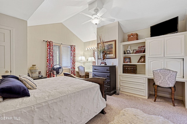 carpeted bedroom featuring vaulted ceiling and ceiling fan