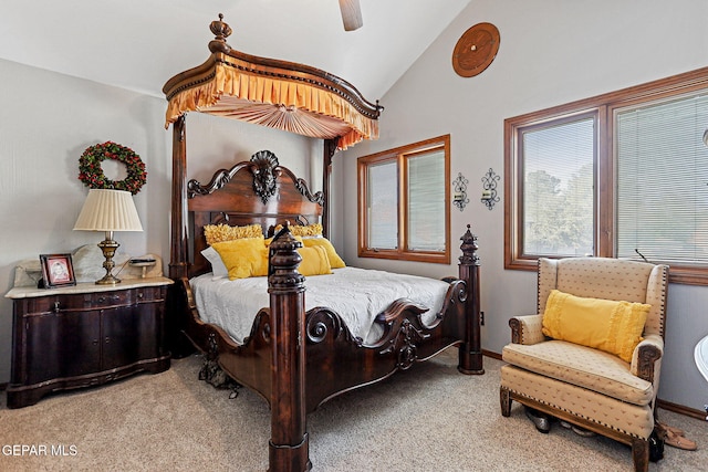 carpeted bedroom with vaulted ceiling and ceiling fan