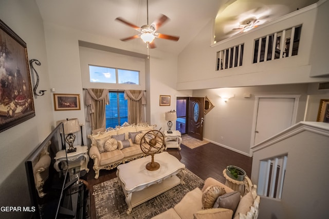 living room featuring hardwood / wood-style flooring, high vaulted ceiling, and ceiling fan