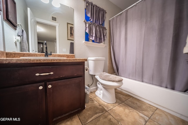 full bathroom featuring shower / bathtub combination with curtain, tile patterned flooring, vanity, and toilet