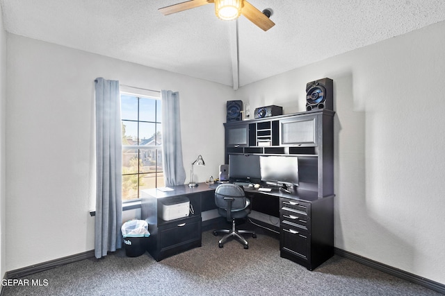 carpeted office with ceiling fan and a textured ceiling