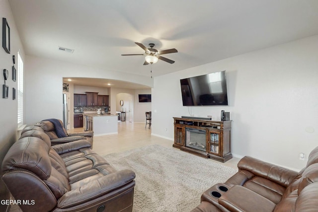 living room featuring ceiling fan