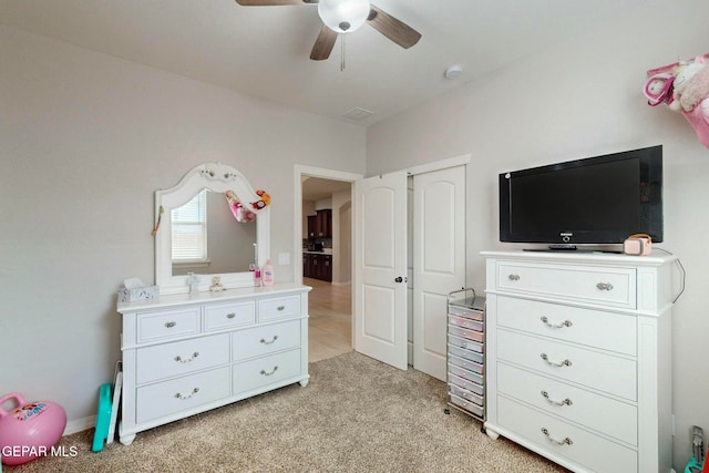 carpeted bedroom featuring ceiling fan