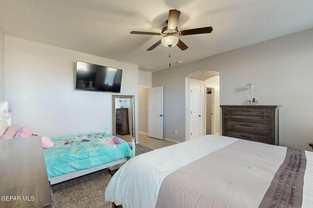 bedroom featuring light carpet and ceiling fan