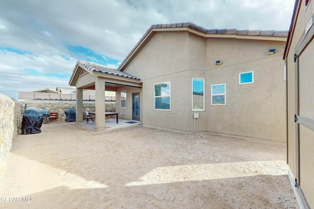 rear view of property with a patio