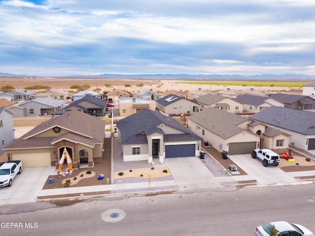 drone / aerial view featuring a mountain view