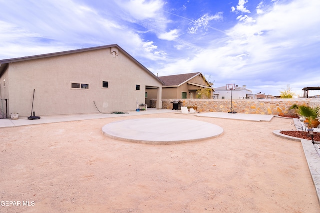 back of house with a patio area