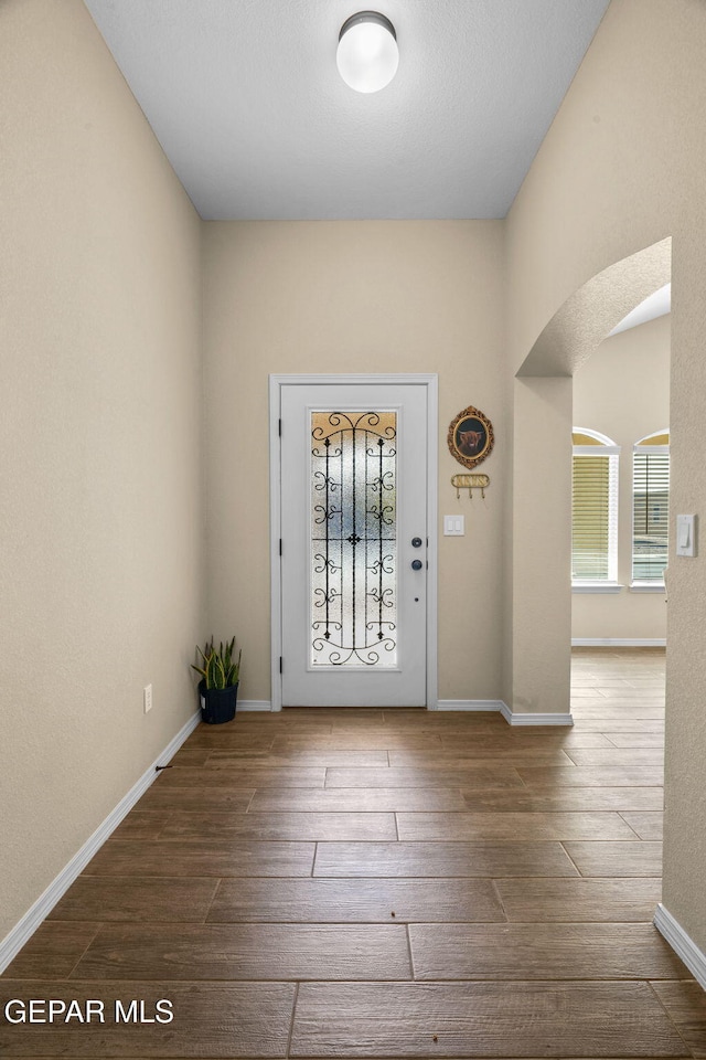 entryway with hardwood / wood-style floors