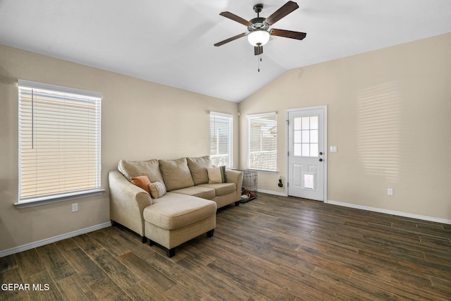 living room featuring ceiling fan, dark wood-type flooring, and vaulted ceiling