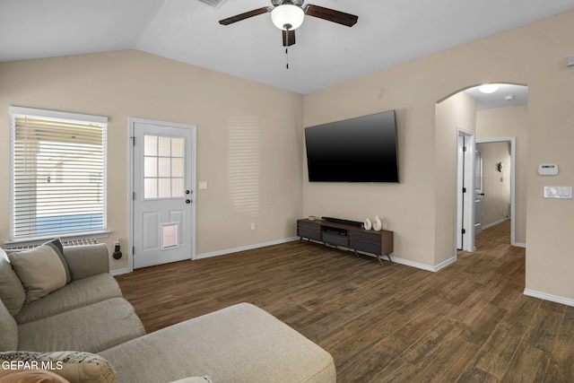 living room with dark hardwood / wood-style flooring, ceiling fan, and lofted ceiling