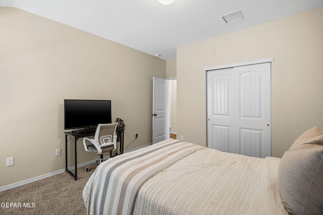 carpeted bedroom with a closet