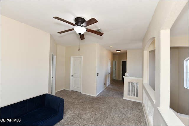 unfurnished room with light carpet and ceiling fan