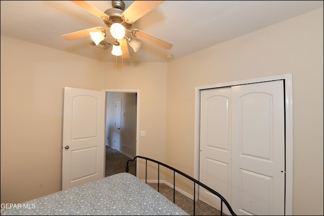 carpeted bedroom featuring a closet and ceiling fan