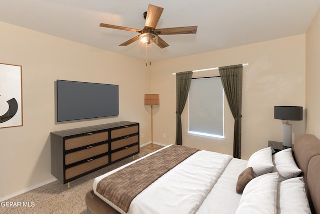 bedroom featuring ceiling fan and carpet floors