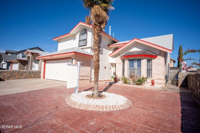 mediterranean / spanish house featuring a garage