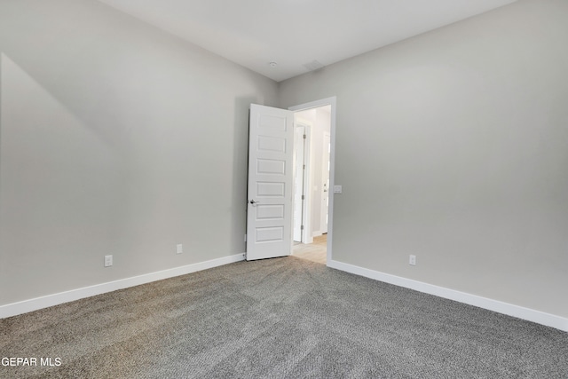 unfurnished room featuring carpet flooring