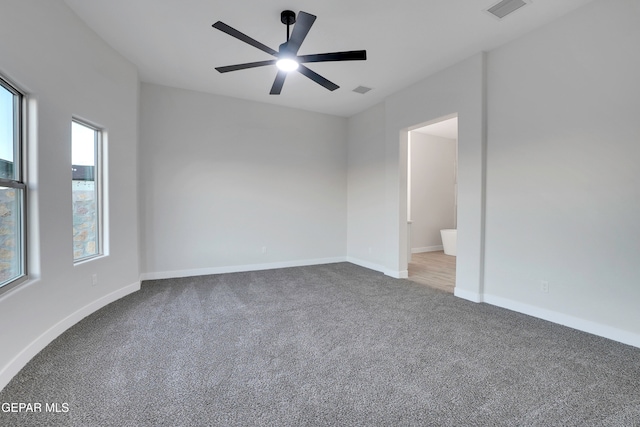 spare room with ceiling fan and carpet flooring