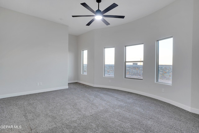 spare room featuring ceiling fan and carpet flooring