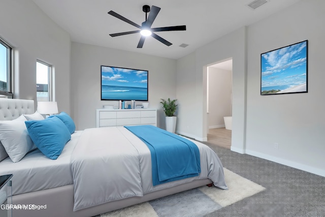 carpeted bedroom featuring ceiling fan, baseboards, and visible vents