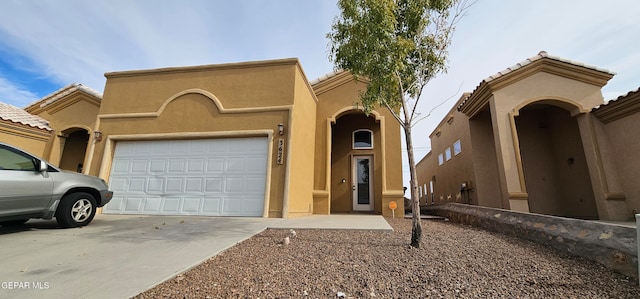 mediterranean / spanish-style house featuring a garage