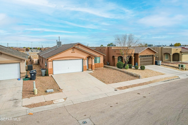 view of front of house featuring a garage, driveway, central AC, and stucco siding