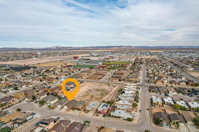 bird's eye view featuring a residential view and a mountain view