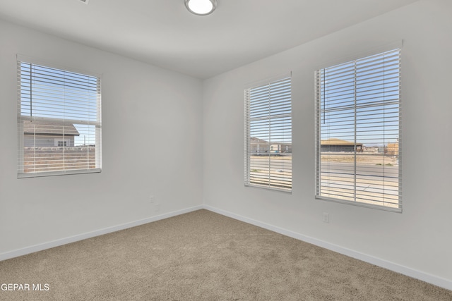 spare room with carpet flooring