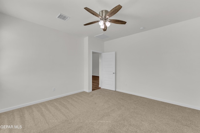 carpeted empty room with ceiling fan