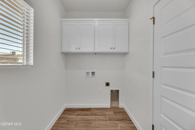 laundry room with hookup for a gas dryer, cabinets, washer hookup, and hookup for an electric dryer