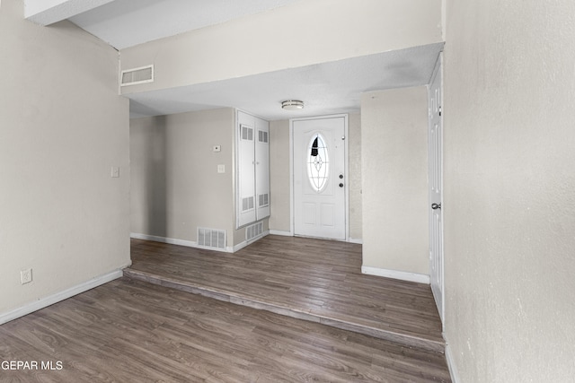 foyer entrance with dark wood-type flooring