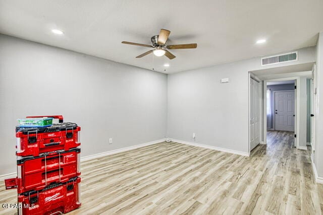 interior space featuring ceiling fan and light wood-type flooring