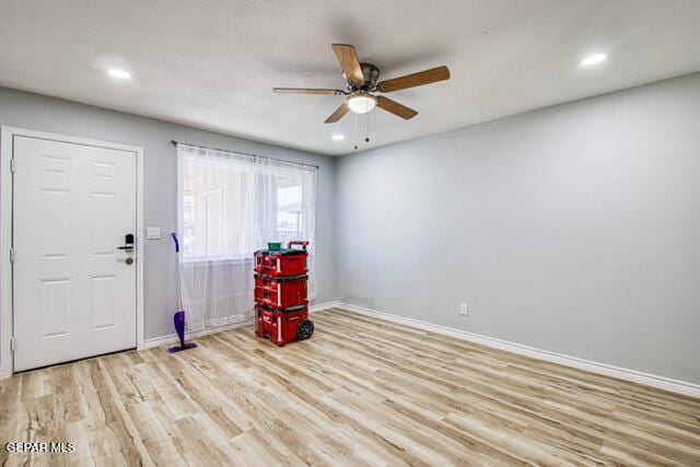 entryway featuring light hardwood / wood-style flooring and ceiling fan