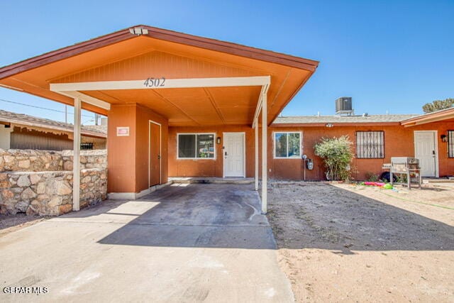 view of front of property with a carport