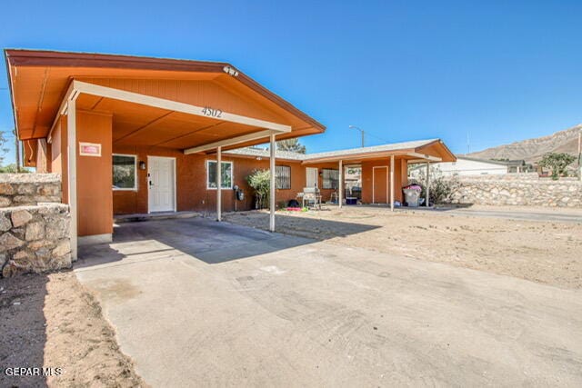 rear view of property with a mountain view