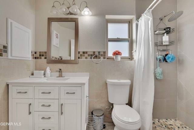 bathroom with vanity, tile walls, and a shower with shower curtain