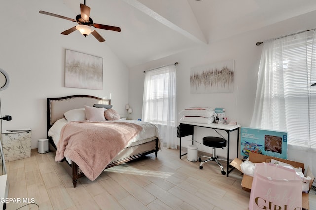 bedroom featuring ceiling fan, light hardwood / wood-style floors, and lofted ceiling