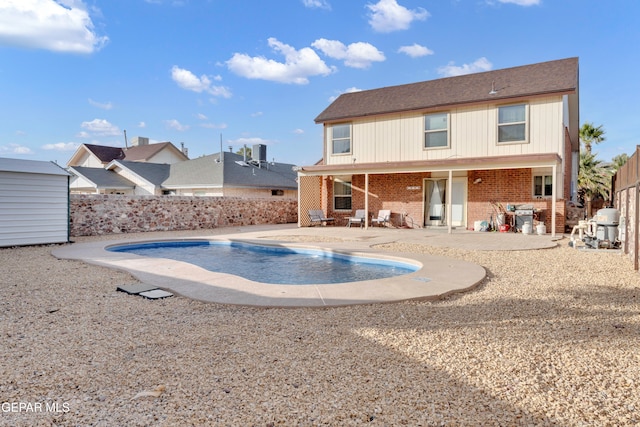 exterior space featuring a fenced in pool and a patio area